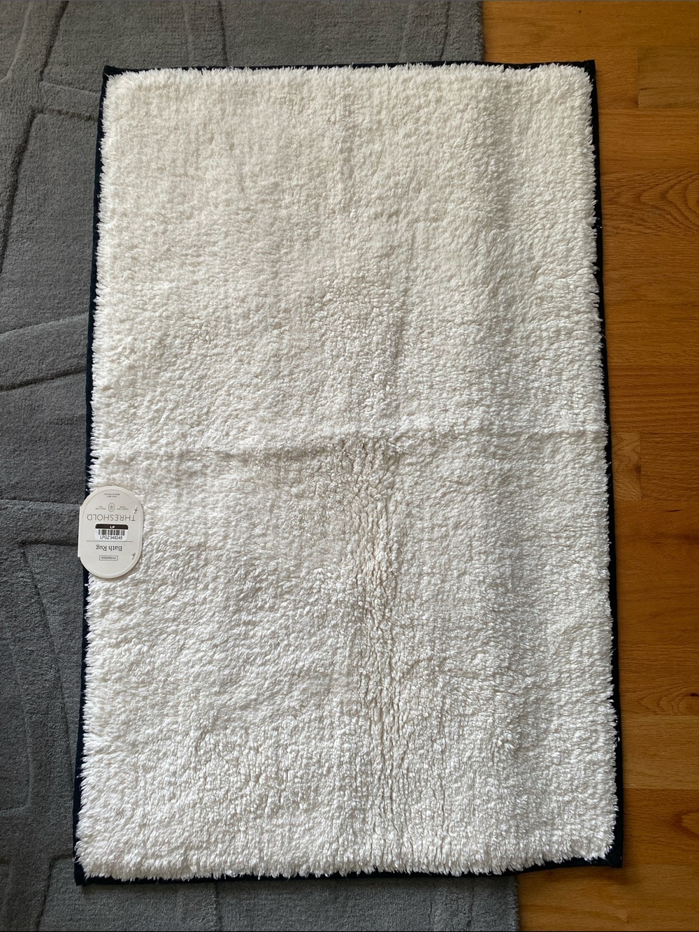 NWT Threshold Ivory and black border Bath Rug